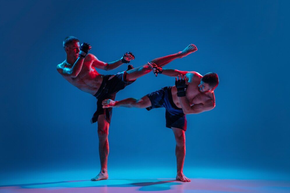 Two men practicing kickboxing. Source: Freepik