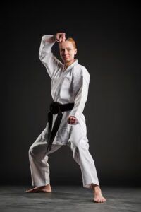 A woman in a karate pose. Source: Freepik