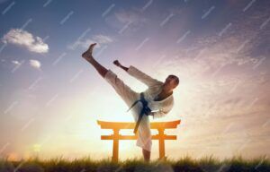 A man practicing japanese martial art with a typical architecture in the background. Source: Freepik